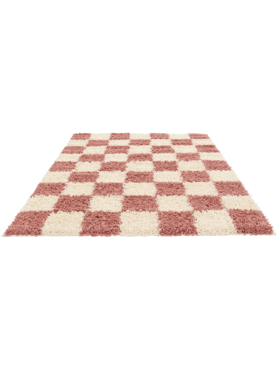 tapis rose et blanc à texture épaisse