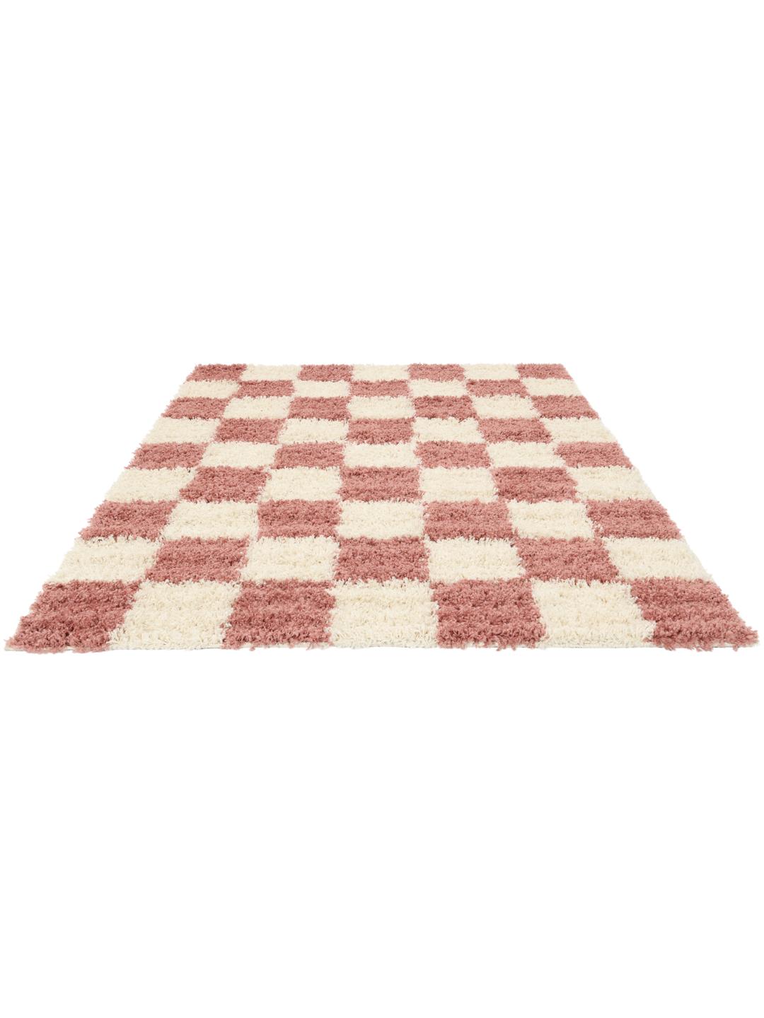 tapis rose et blanc à texture épaisse
