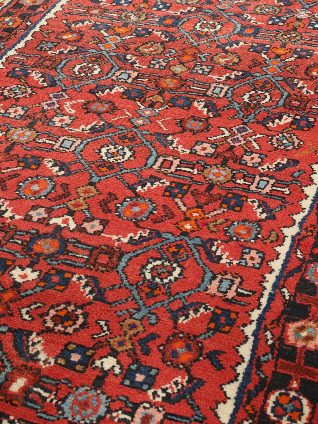 Handgeknoopte Hosseinabad loper uit het Midden-Oosten in dieprood met geometrische patronen