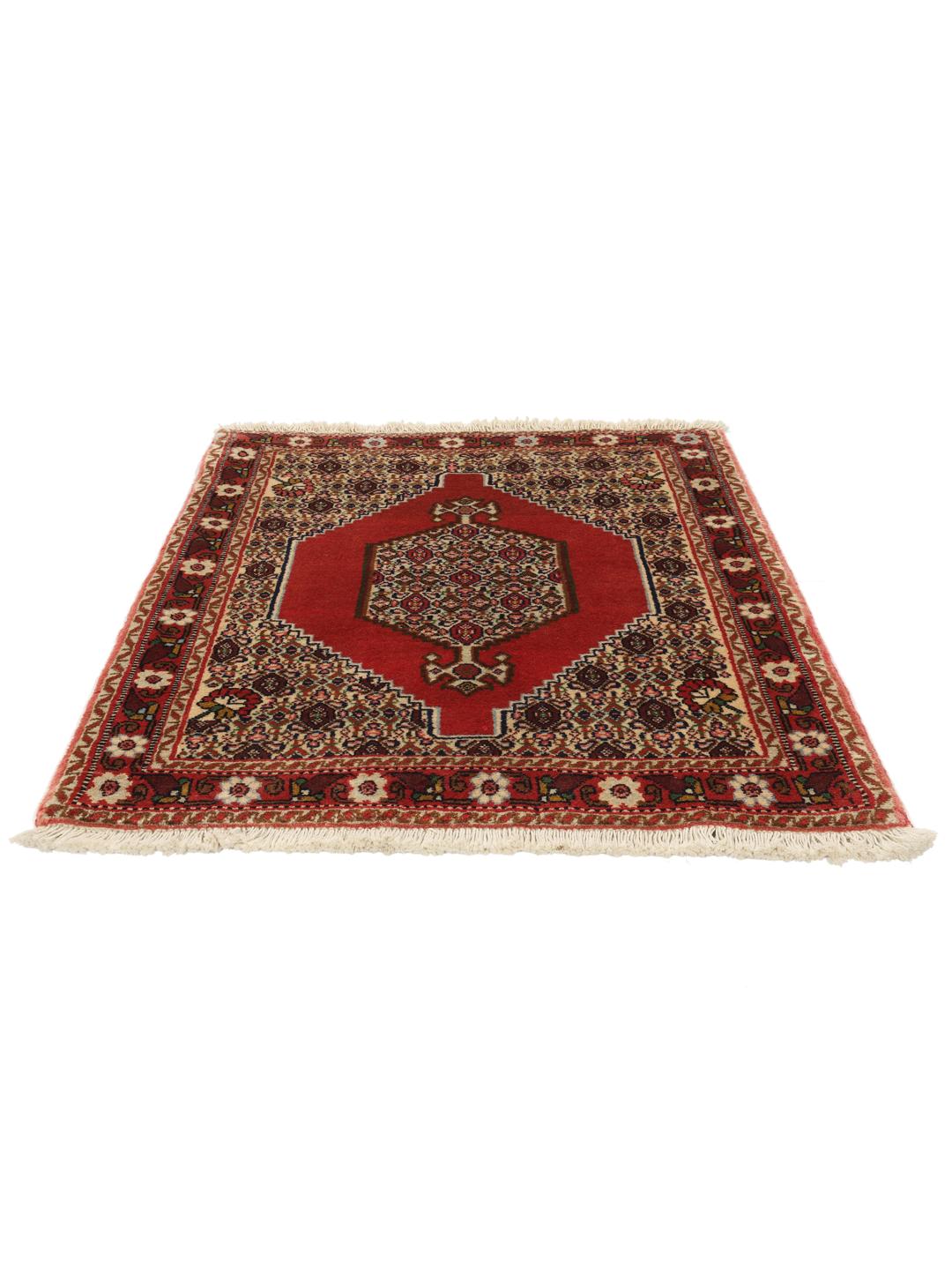 A hand-knotted Senneh rug from the Middle East in vibrant red tones.