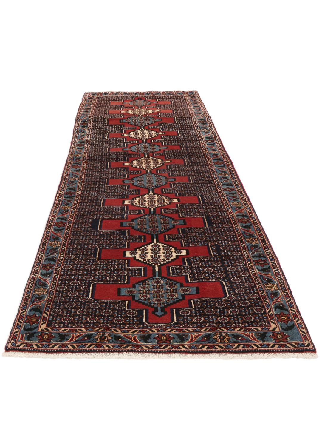 Hand-knotted Senneh runner with a geometric pattern in red and blue tones from the Middle East