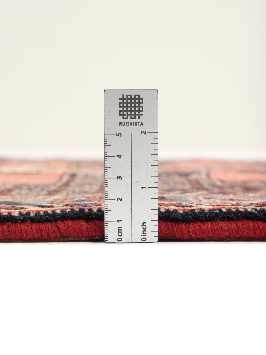 Hand-knotted Senneh runner with a geometric pattern in red and blue tones from the Middle East