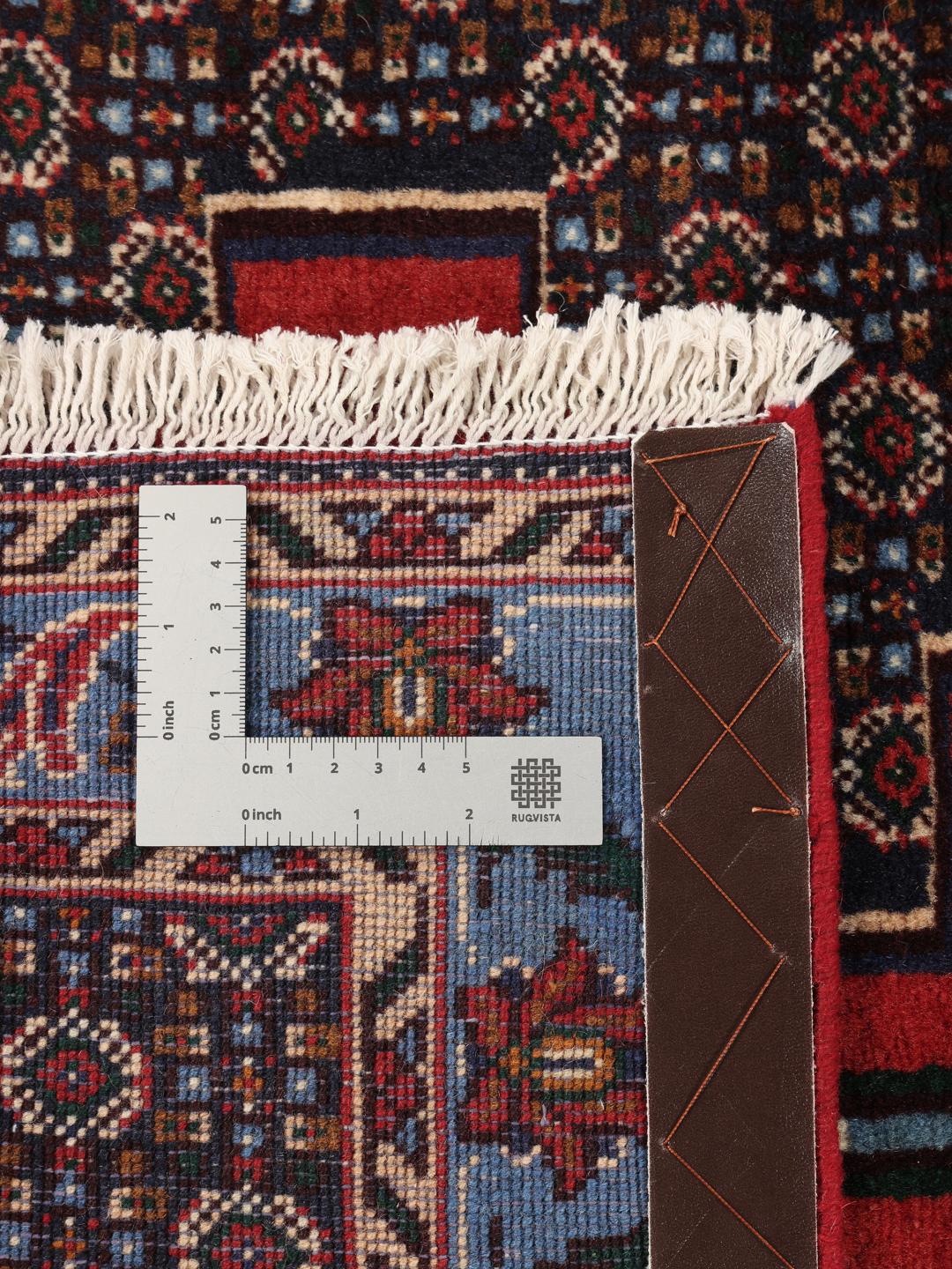 Hand-knotted Senneh runner with a geometric pattern in red and blue tones from the Middle East