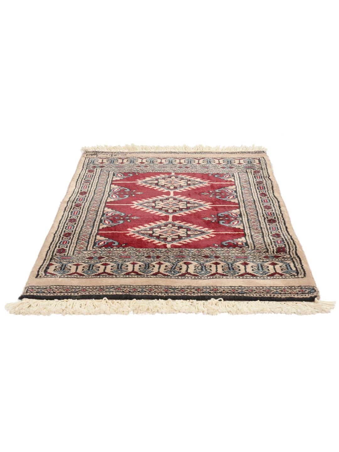 A hand-knotted Pakistan Bokhara rug in red and beige tones with traditional geometric motifs.