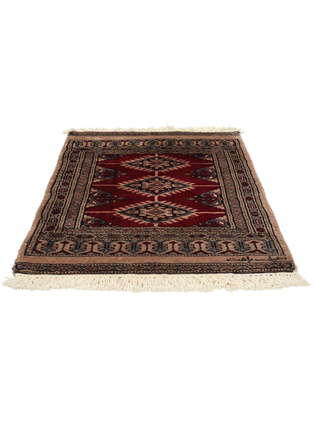 A hand-knotted Pakistan Bokhara rug in red and beige tones with traditional geometric motifs.