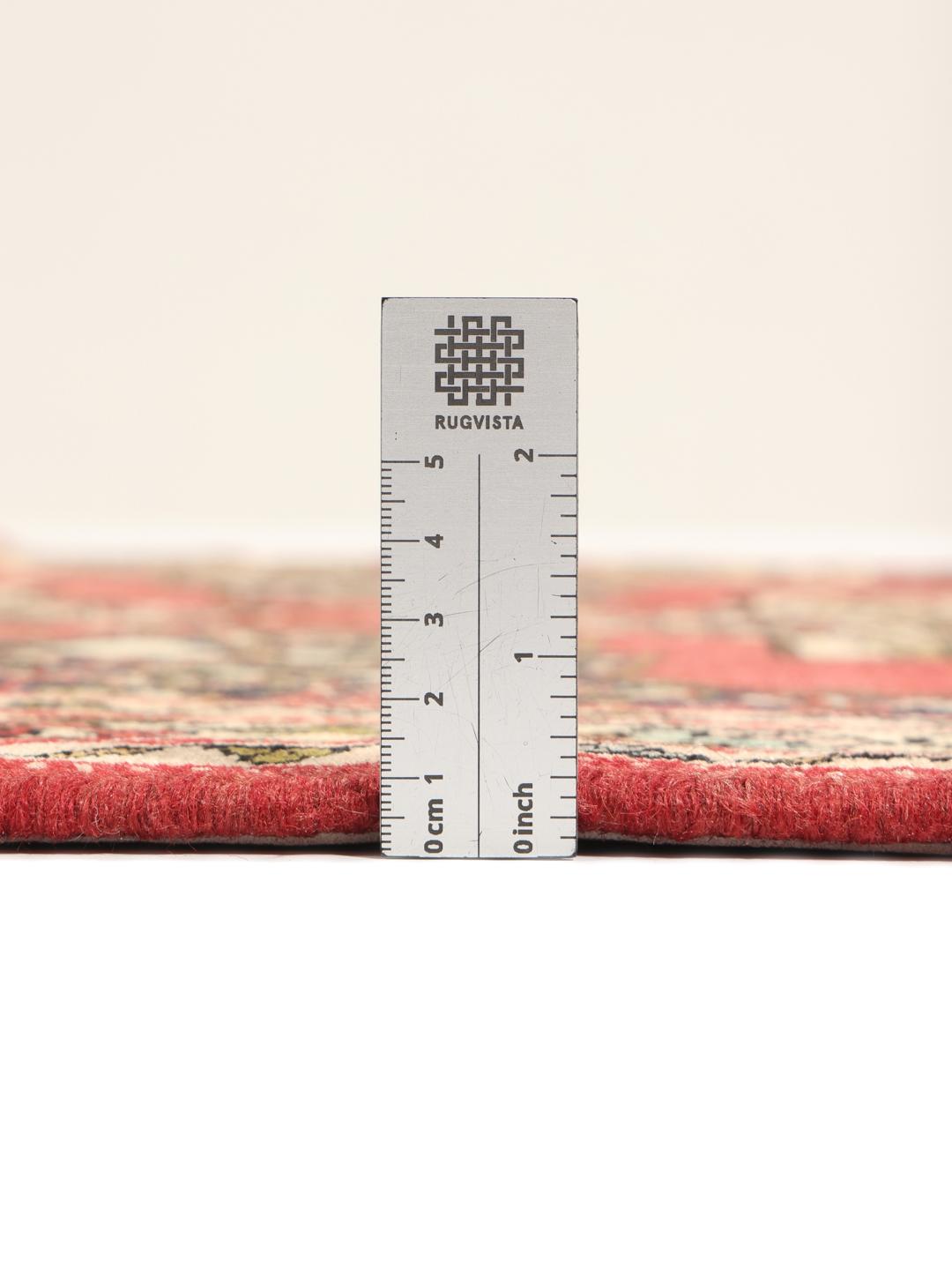 Hand-knotted Senneh runner from the Middle East in shades of red and dark blue.