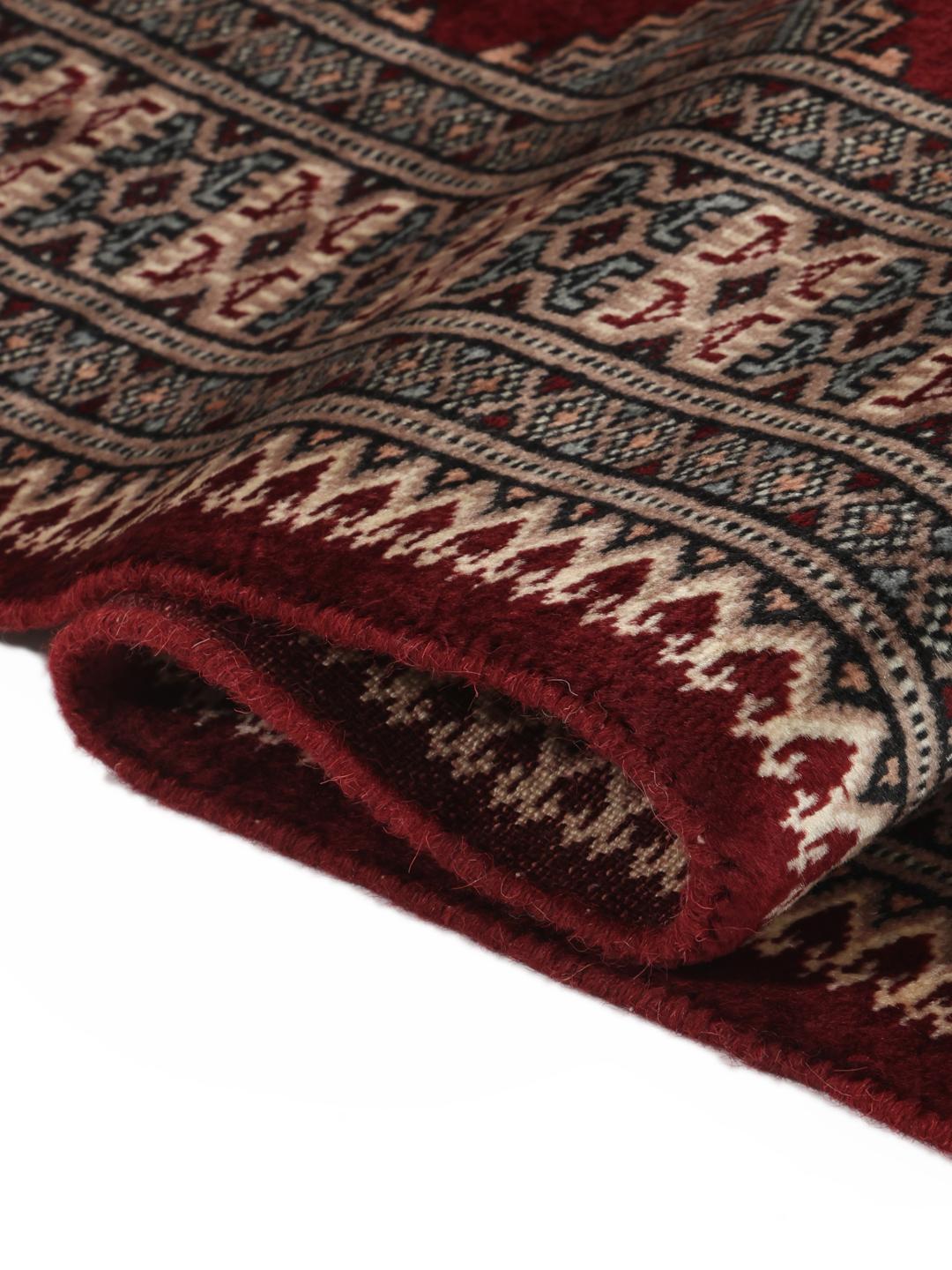 Hand-knotted Pakistan Bokhara 3ply rug in dark-red with classic motifs