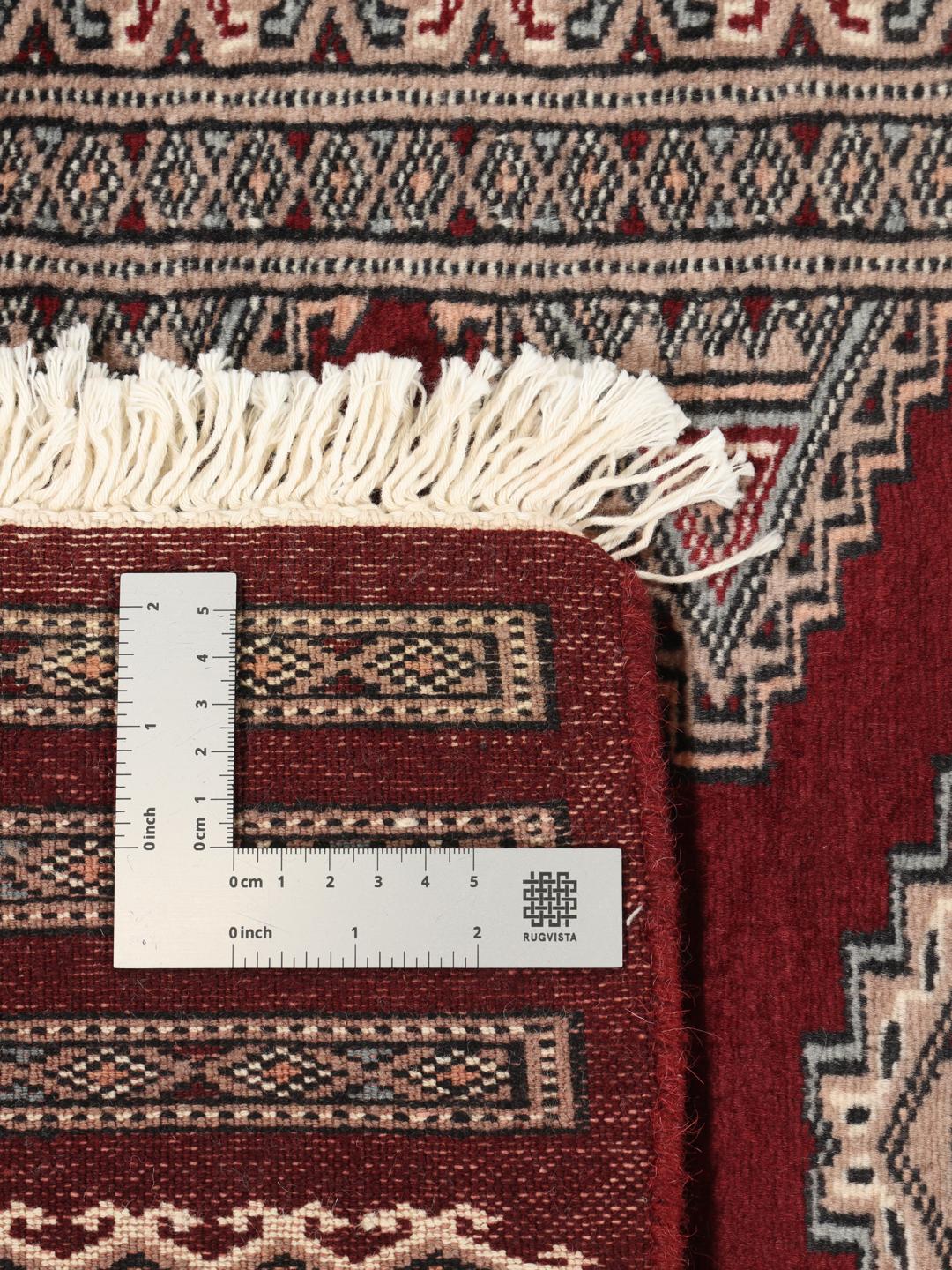 Hand-knotted Pakistan Bokhara 3ply rug in dark-red with classic motifs