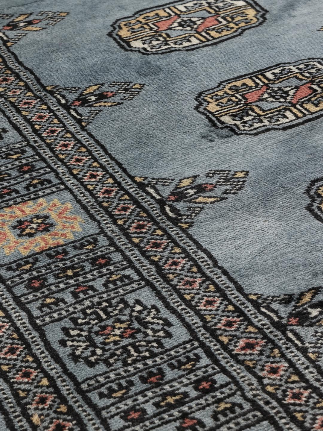 Hand-knotted Pakistan Bokhara runner rug in blue with traditional motifs