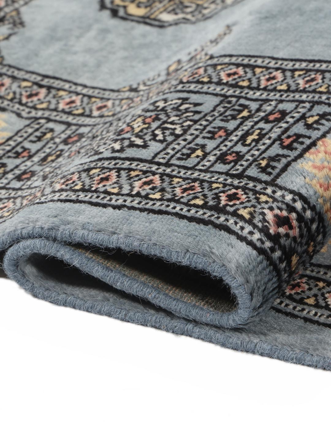 Hand-knotted Pakistan Bokhara runner rug in blue with traditional motifs