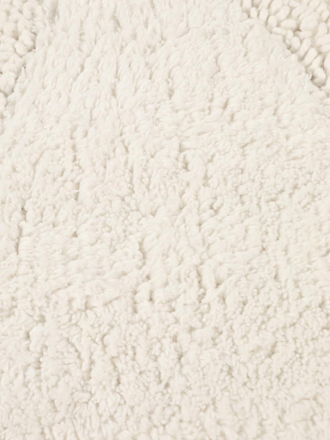 Tapis de bain rond blanc avec un motif de vagues texturé