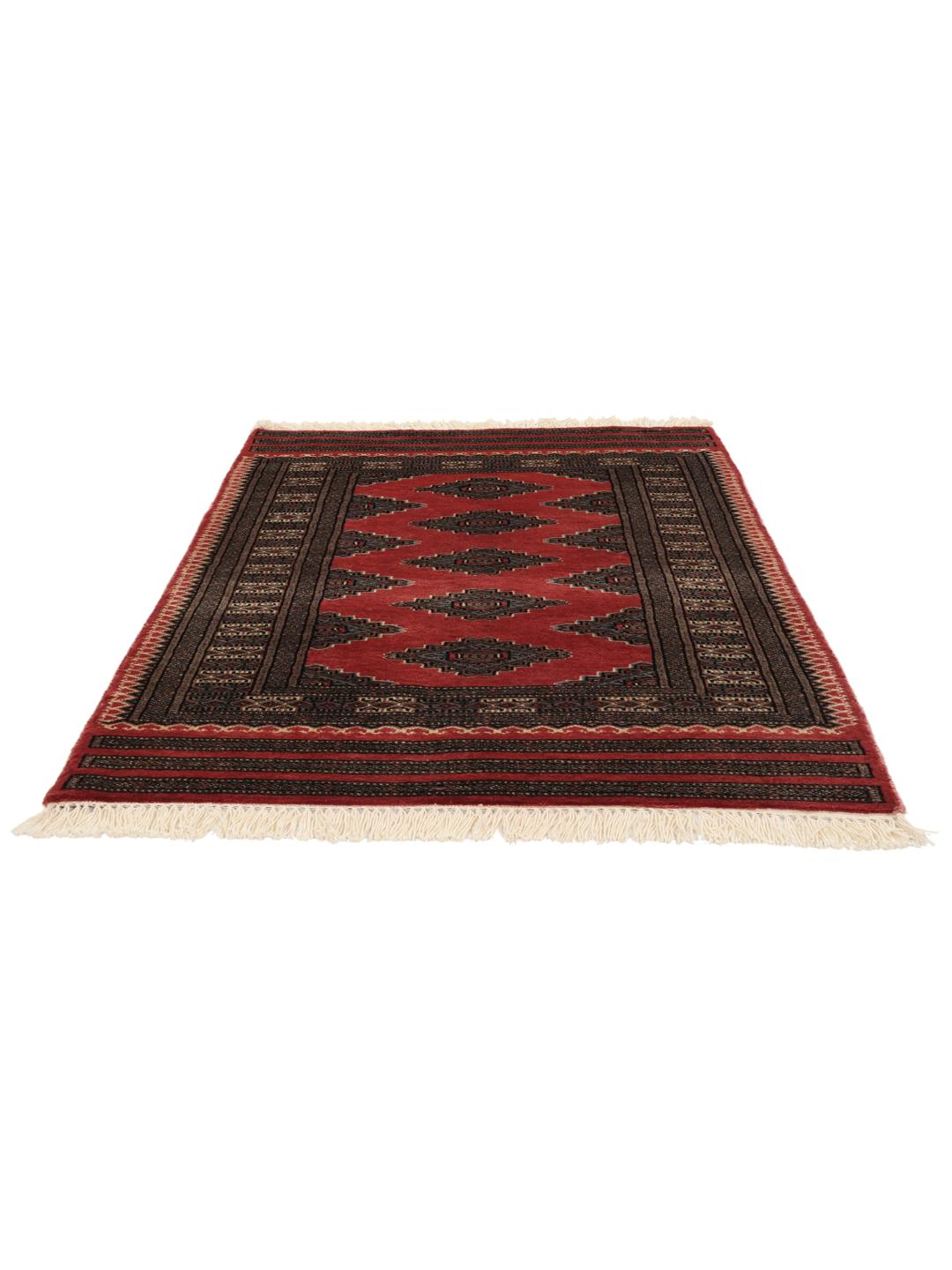 A hand-knotted red Pakistan Bokhara rug with traditional geometric motifs.
