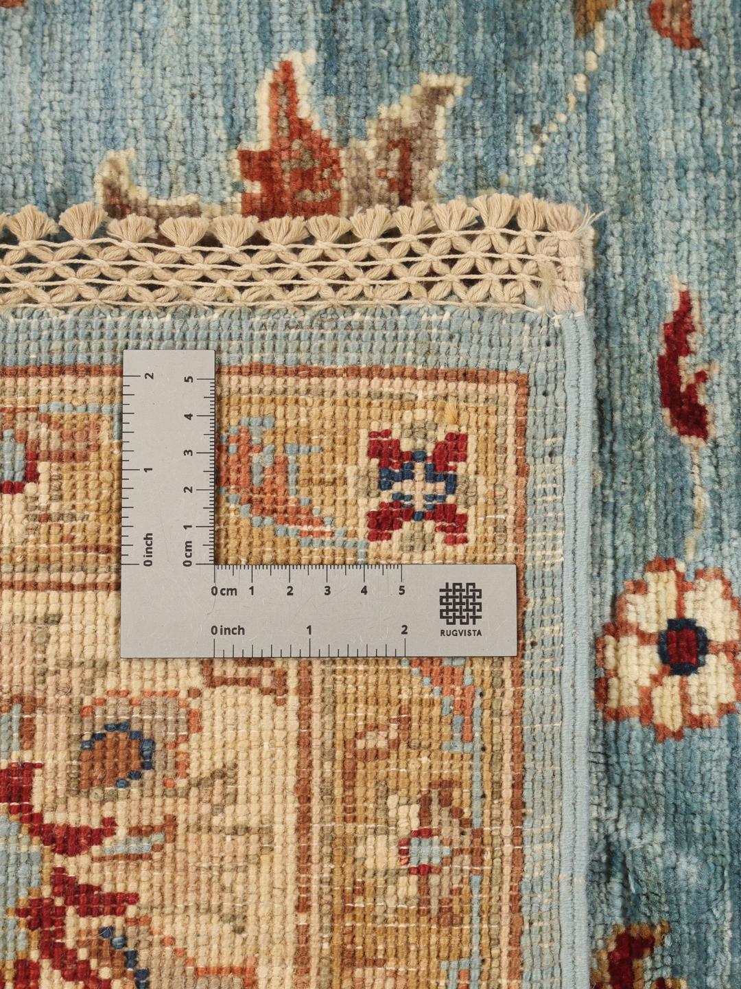 Håndknyttet Ziegler Fine tæppe fra Pakistan i blå og beige nuancer med blomstermønstre.