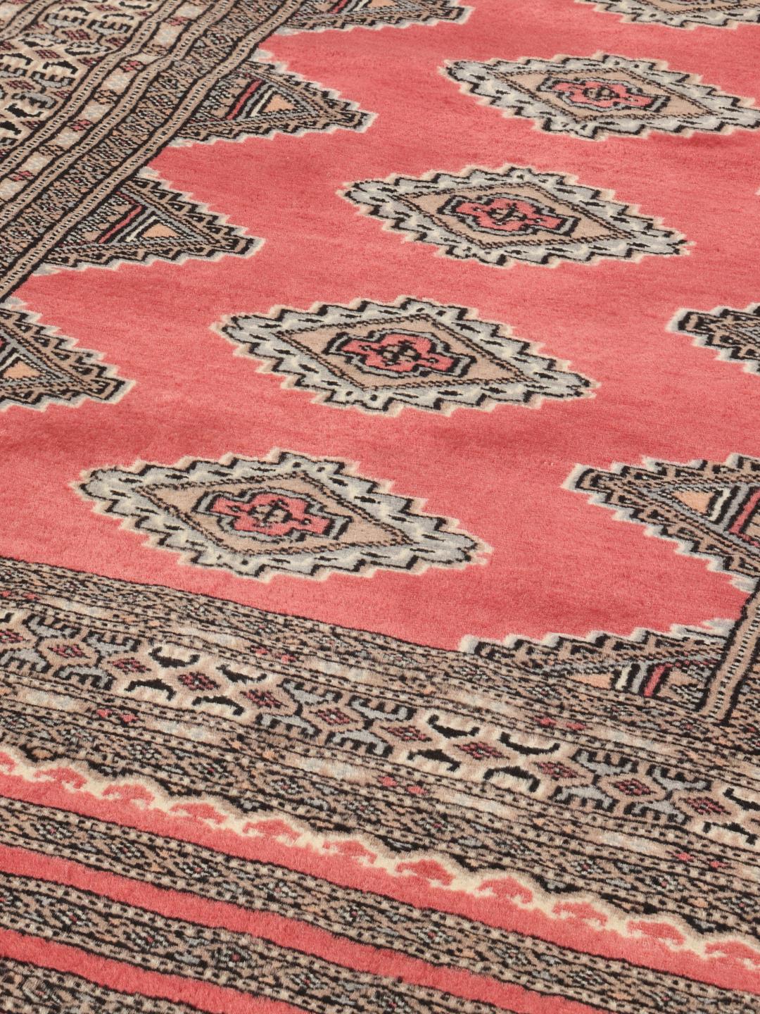 Hand-knotted red Pakistan Bokhara rug with geometric motifs