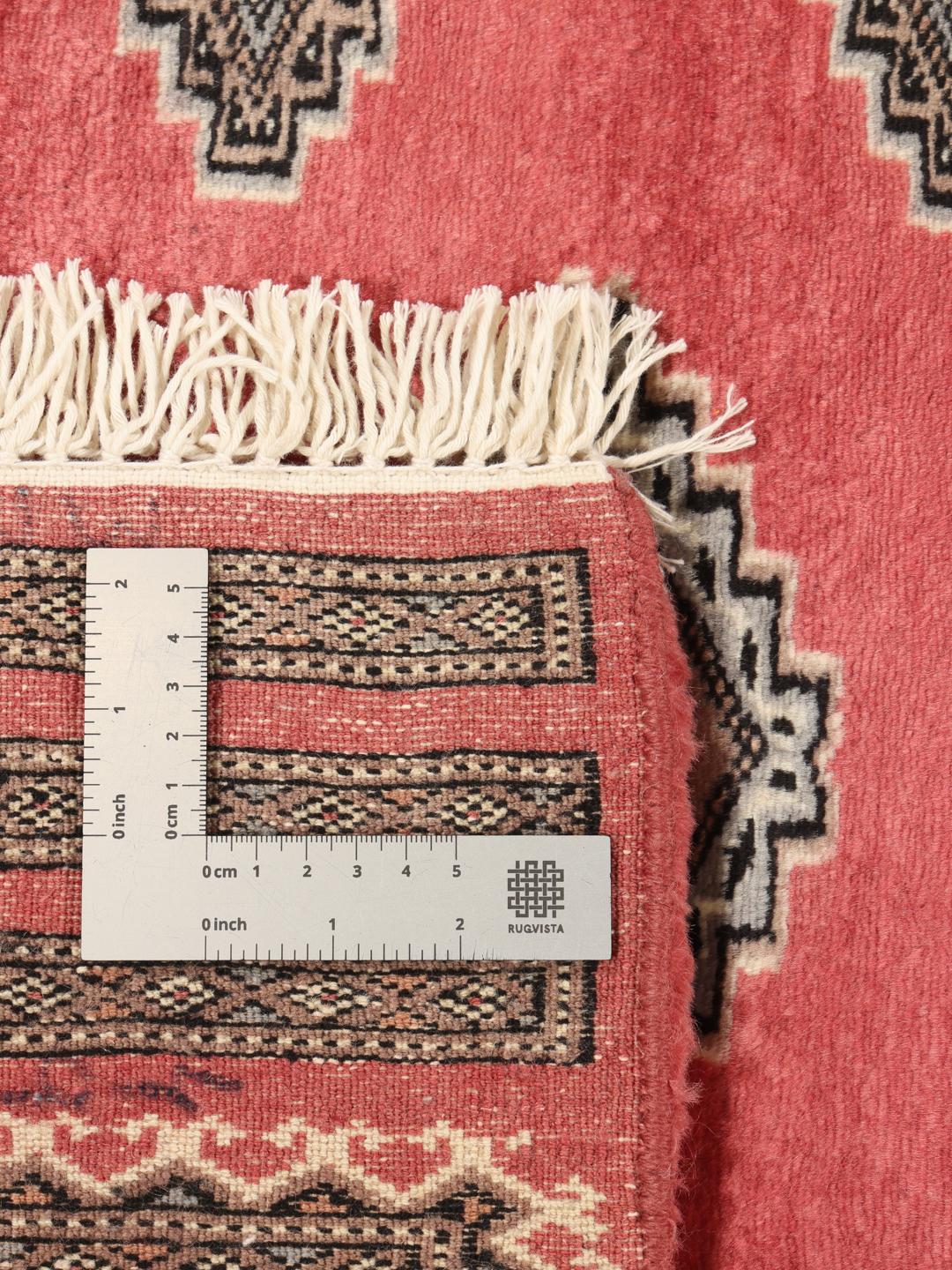 Hand-knotted red Pakistan Bokhara rug with geometric motifs