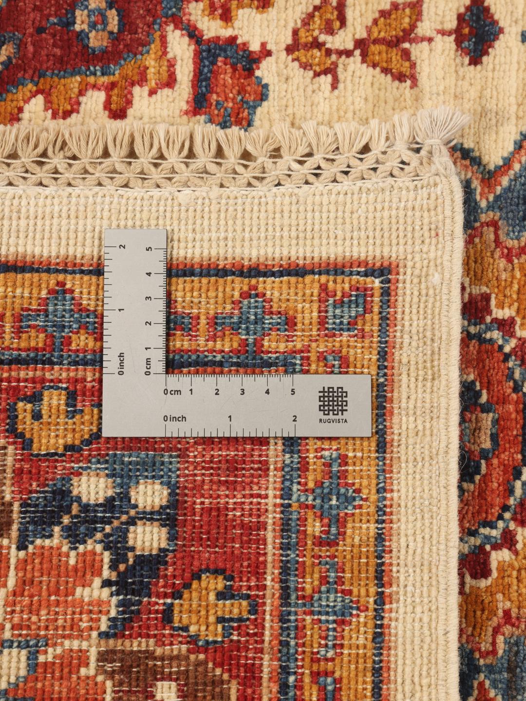 Handgeknoopt Pakistaans tapijt met een floraal en paisley patroon in rood en beige