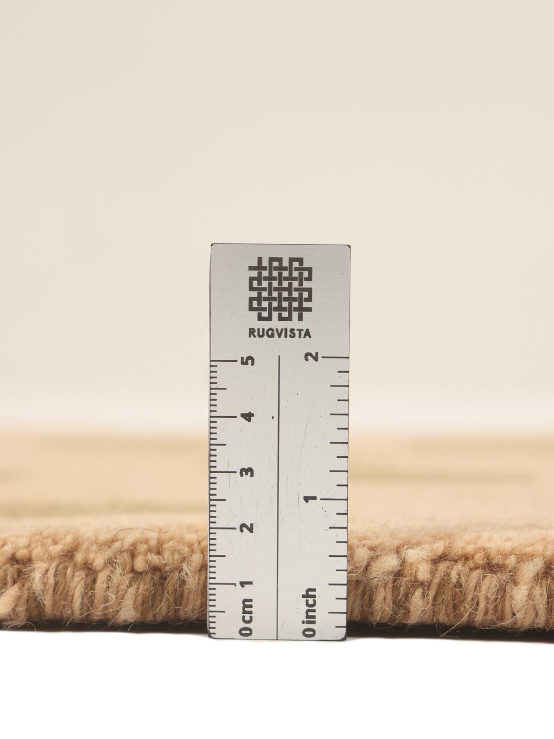 Hand-knotted Gabbeh wool rug from the Middle East in beige