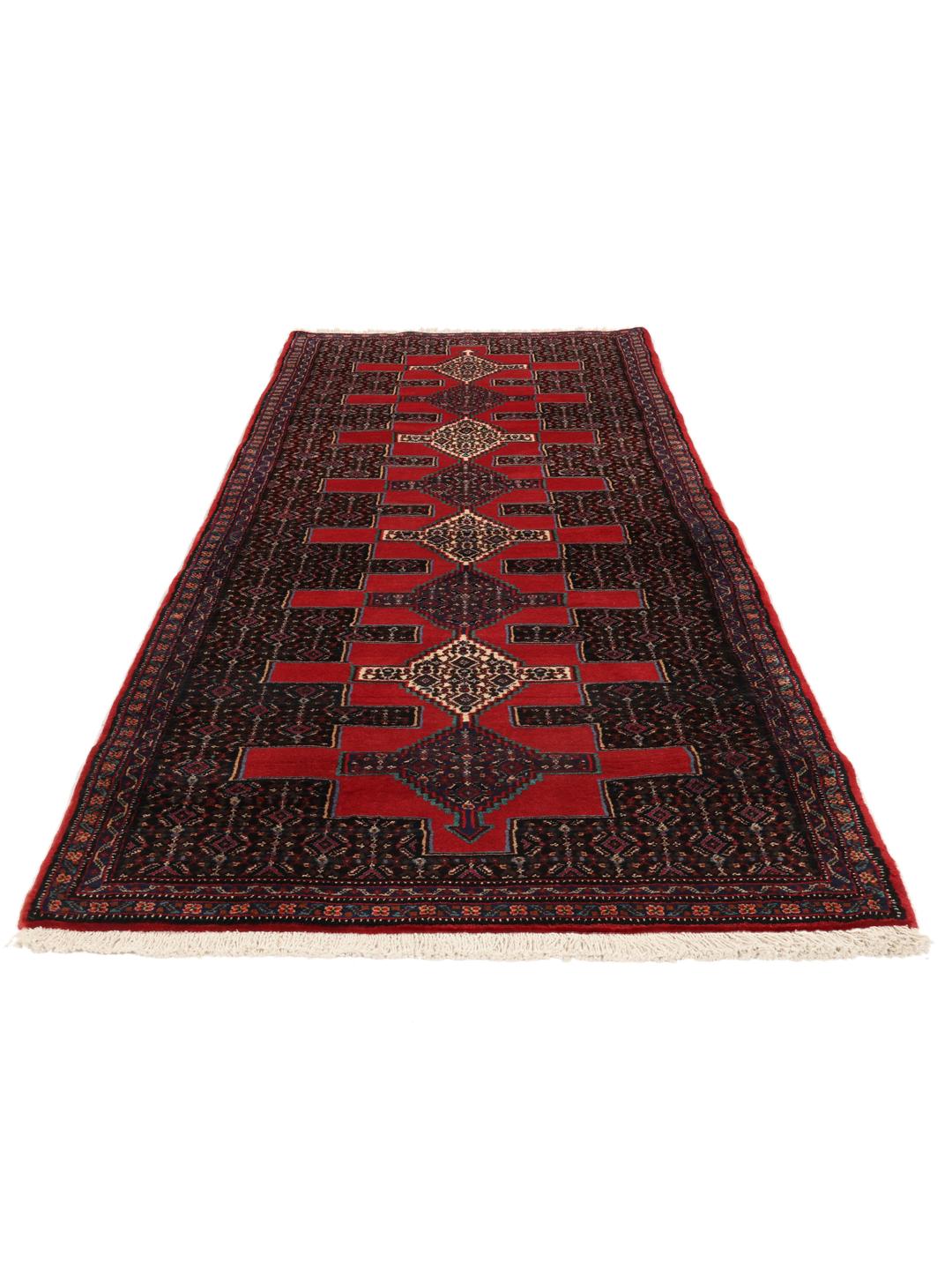 A hand-knotted Senneh runner from the Middle East in dark-red and black tones.