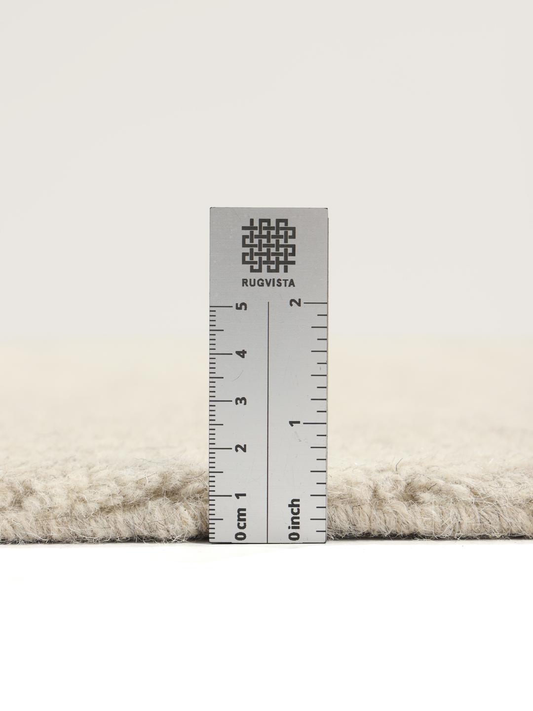Beige tapijt met details in hoge en lage pool