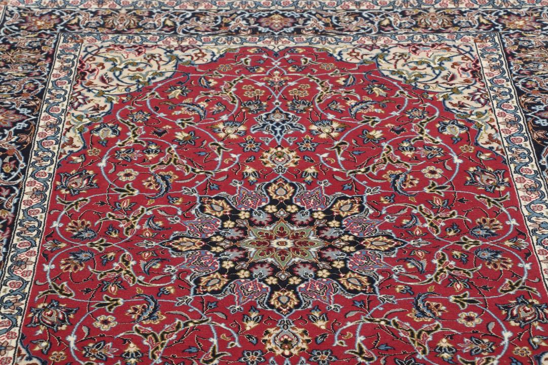 Hand-knotted Isfahan rug with dark-red and black floral patterns