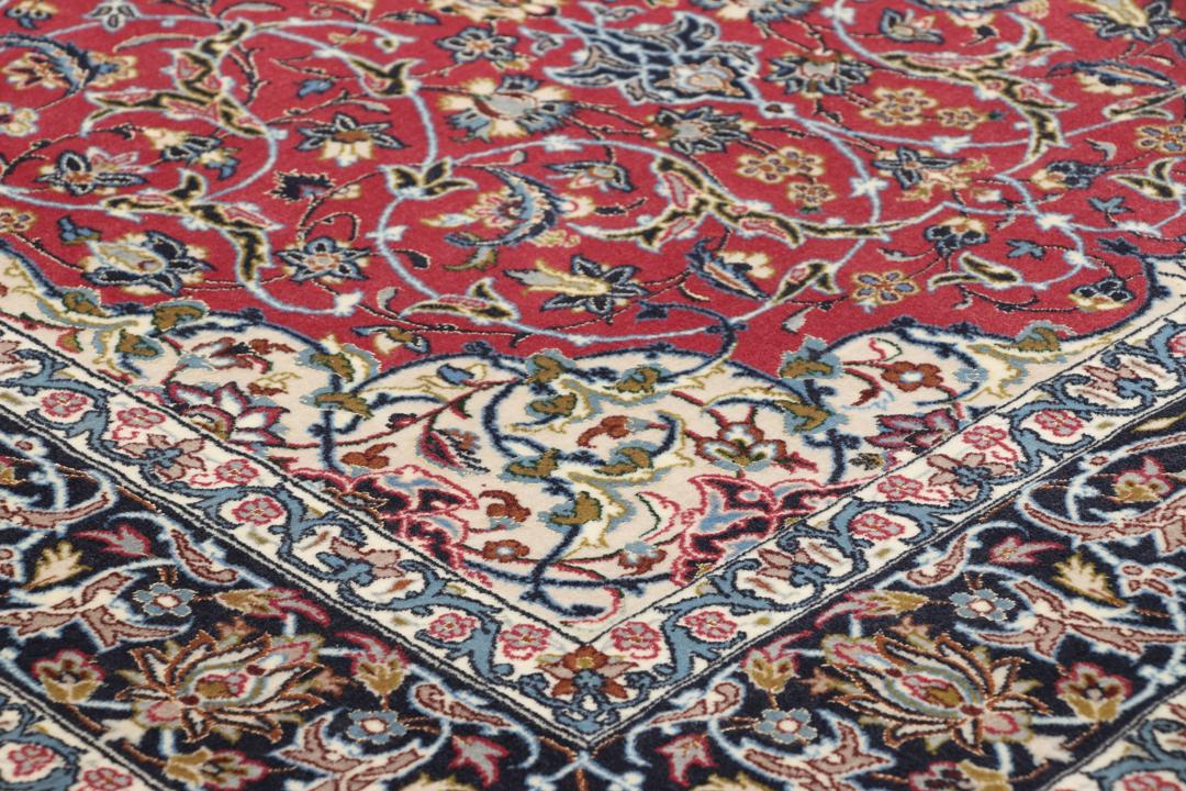 Hand-knotted Isfahan rug with dark-red and black floral patterns