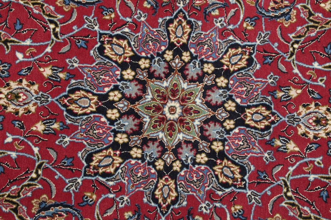 Hand-knotted Isfahan rug with dark-red and black floral patterns