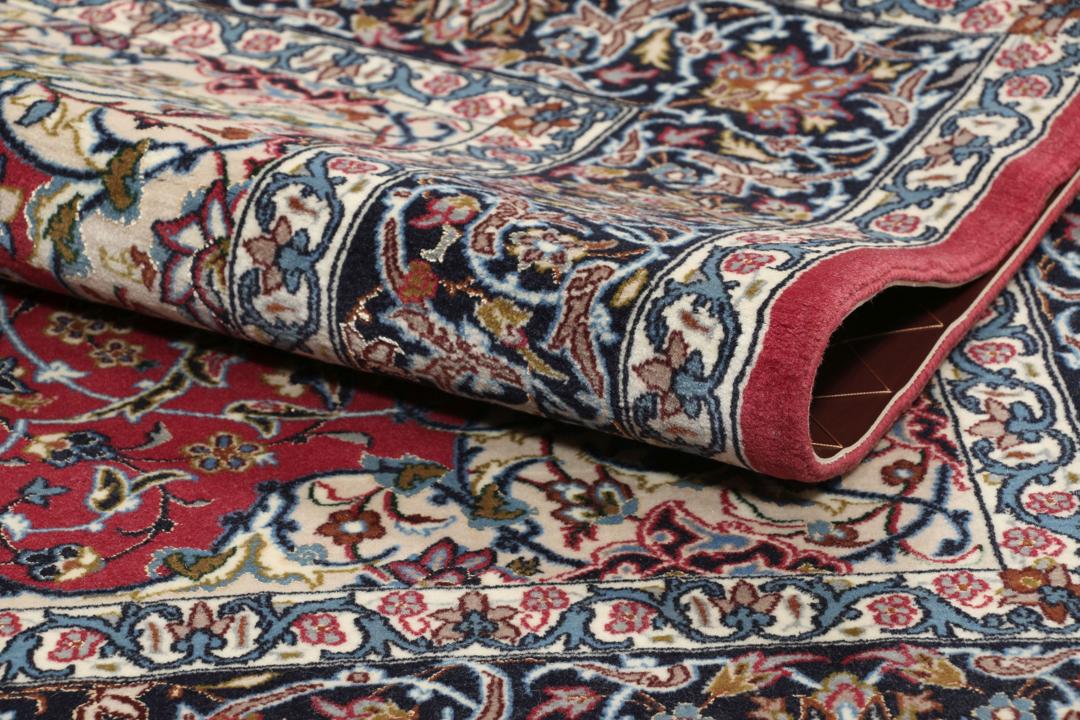 Hand-knotted Isfahan rug with dark-red and black floral patterns
