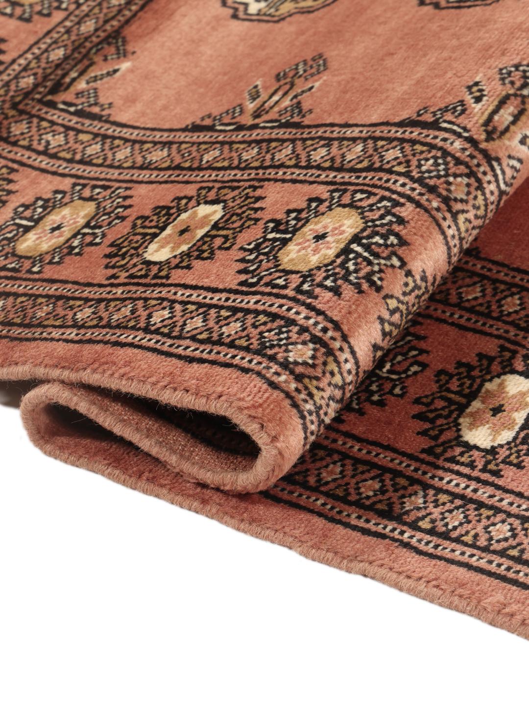 Hand-knotted Pakistan Bokhara rug in red with traditional gul patterns