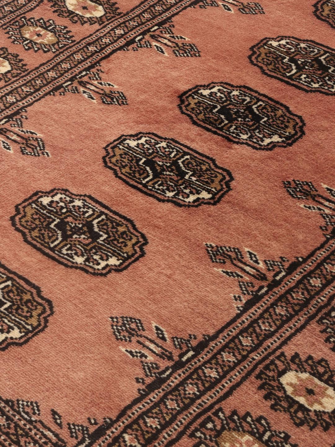 Hand-knotted Pakistan Bokhara 2ply rug in red with traditional motifs