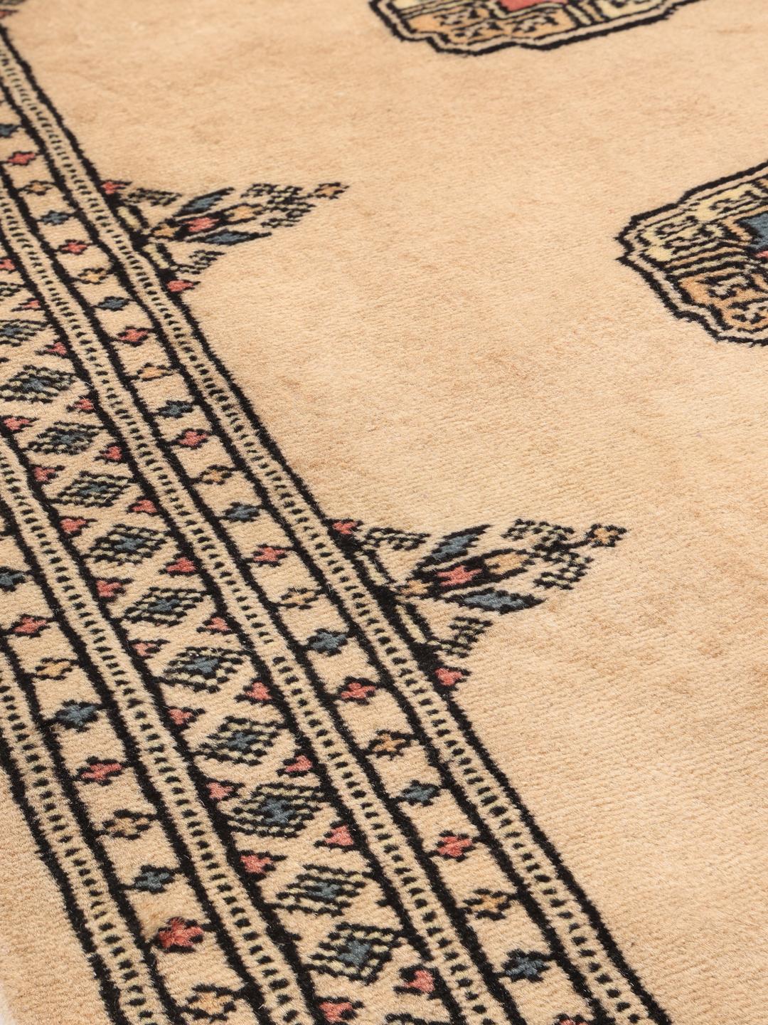 Hand-knotted Pakistan Bokhara 2ply rug in beige with traditional patterns