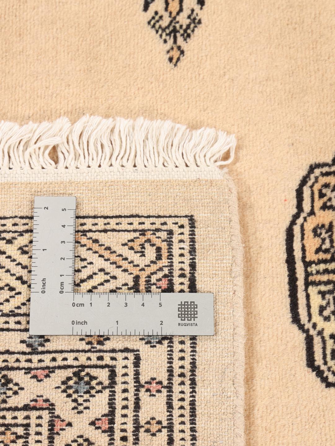 Hand-knotted Pakistan Bokhara 2ply rug in beige with traditional patterns