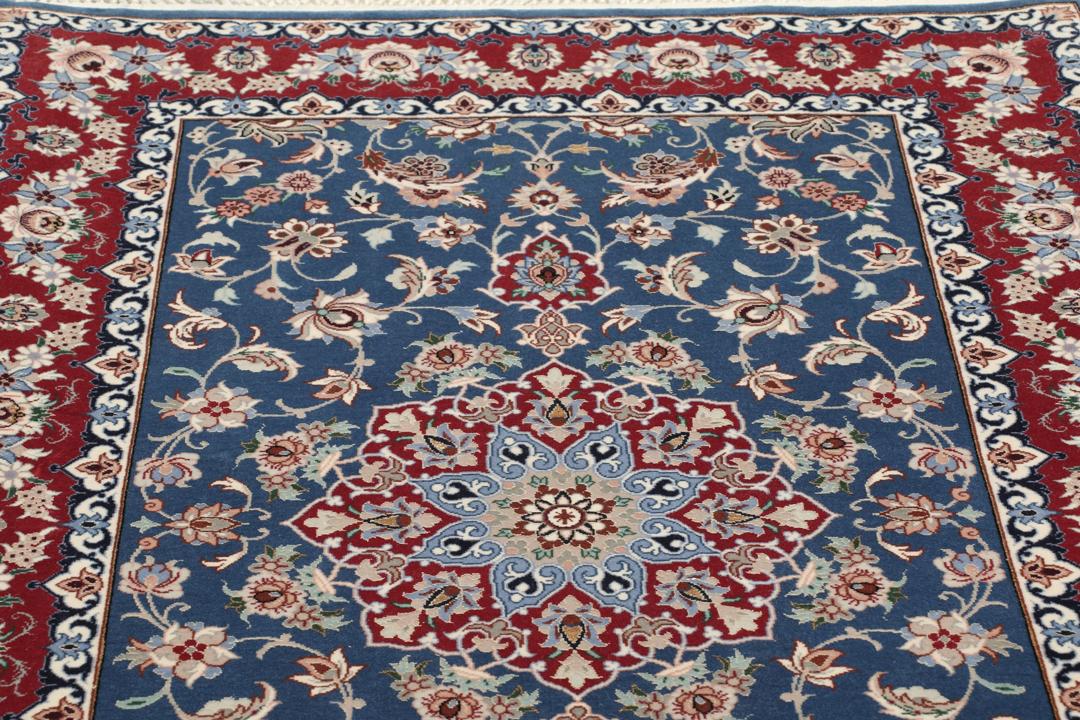 Handgeknoopt Isfahan-tapijt met bloemmotieven in blauw en rood