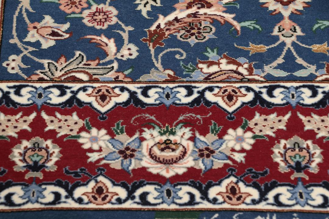 Handgeknoopt Isfahan-tapijt met bloemmotieven in blauw en rood