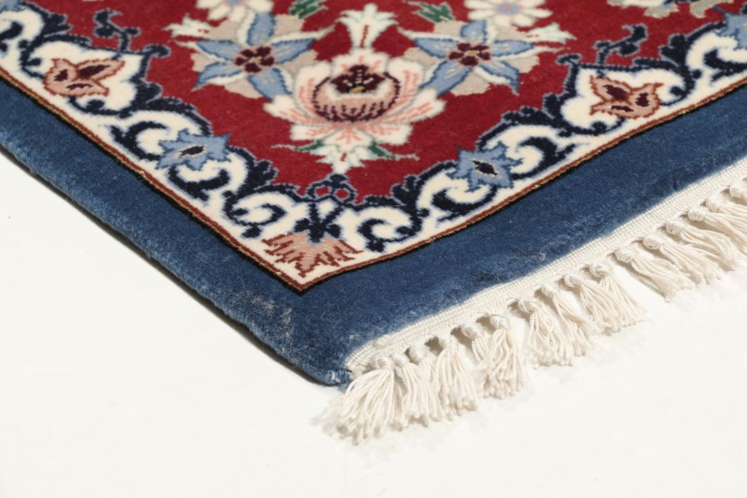 Handgeknoopt Isfahan-tapijt met bloemmotieven in blauw en rood