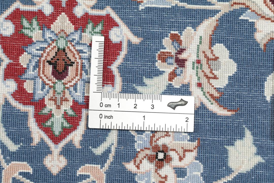 Handgeknoopt Isfahan-tapijt met bloemmotieven in blauw en rood