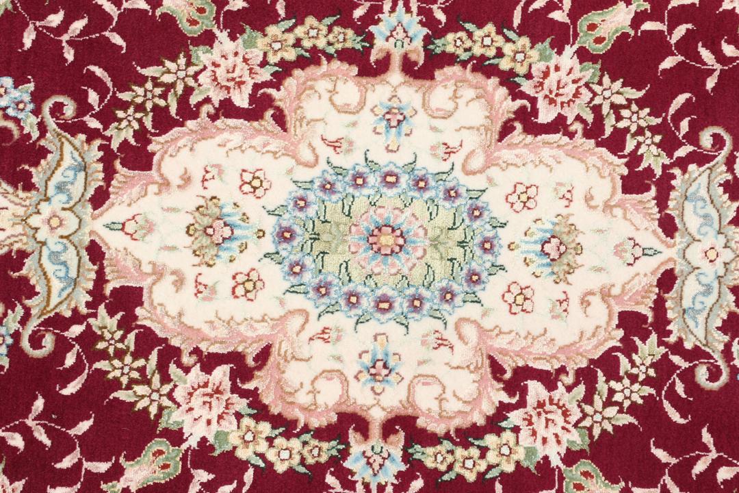 Handgeknoopt Tabriz-tapijt met bloemmotief en medaillon in rood en donkerblauw uit het Midden-Oosten