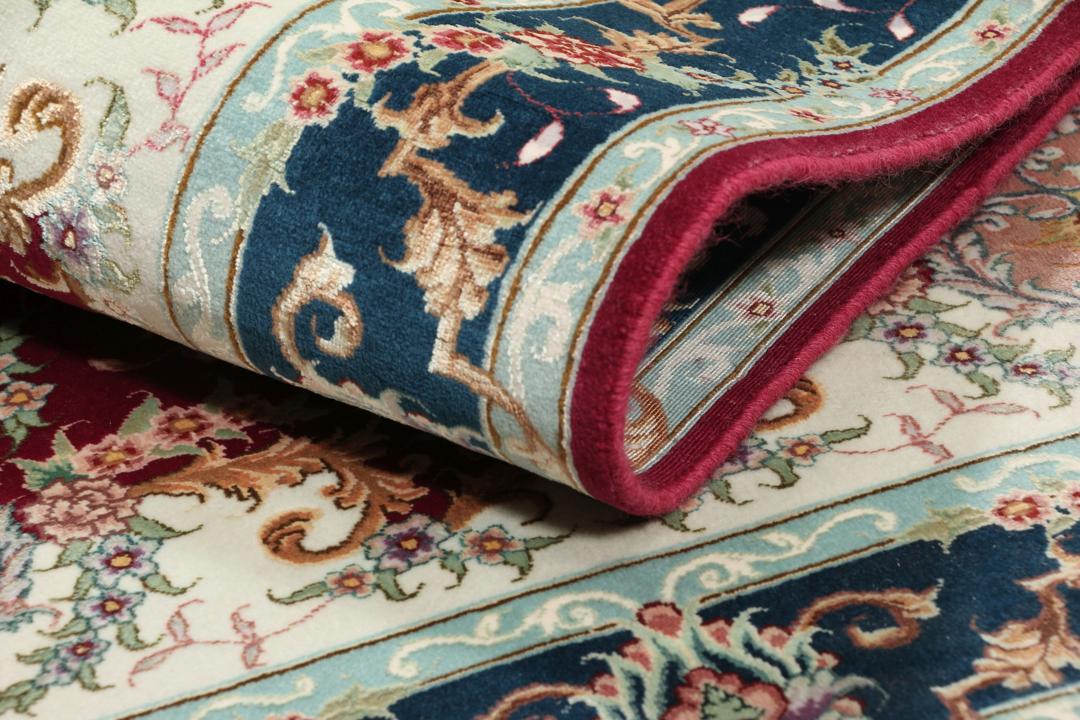 Handgeknoopt Tabriz-tapijt met bloemmotief en medaillon in rood en donkerblauw uit het Midden-Oosten