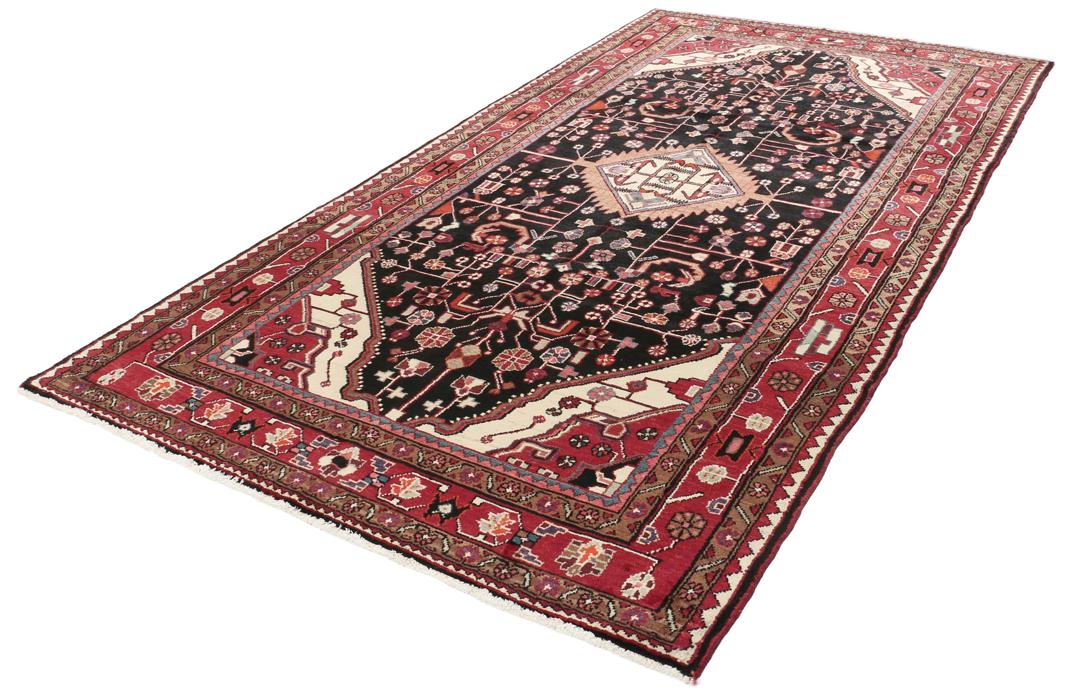 A one-of-a-kind Hamadan rug from the Middle East with a dark-red and black palette.