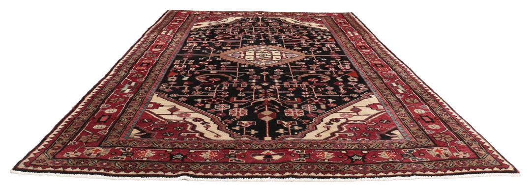 A one-of-a-kind Hamadan rug from the Middle East with a dark-red and black palette.