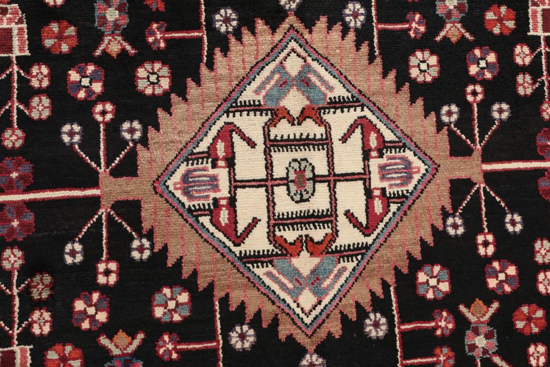 A one-of-a-kind Hamadan rug from the Middle East with a dark-red and black palette.