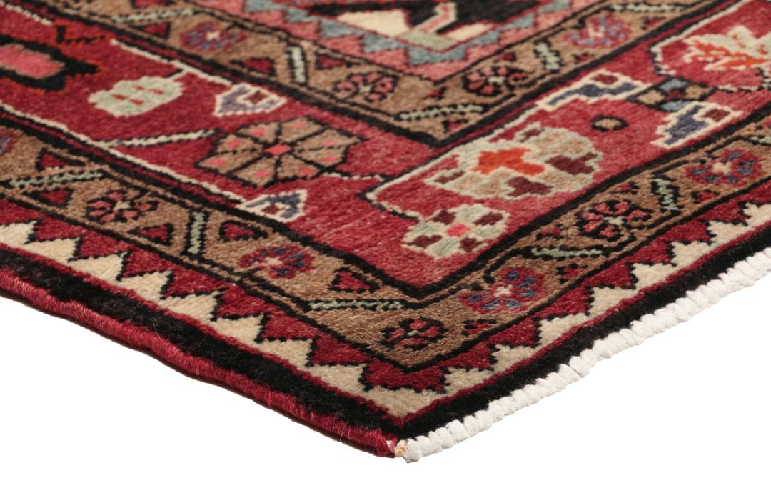 A one-of-a-kind Hamadan rug from the Middle East with a dark-red and black palette.