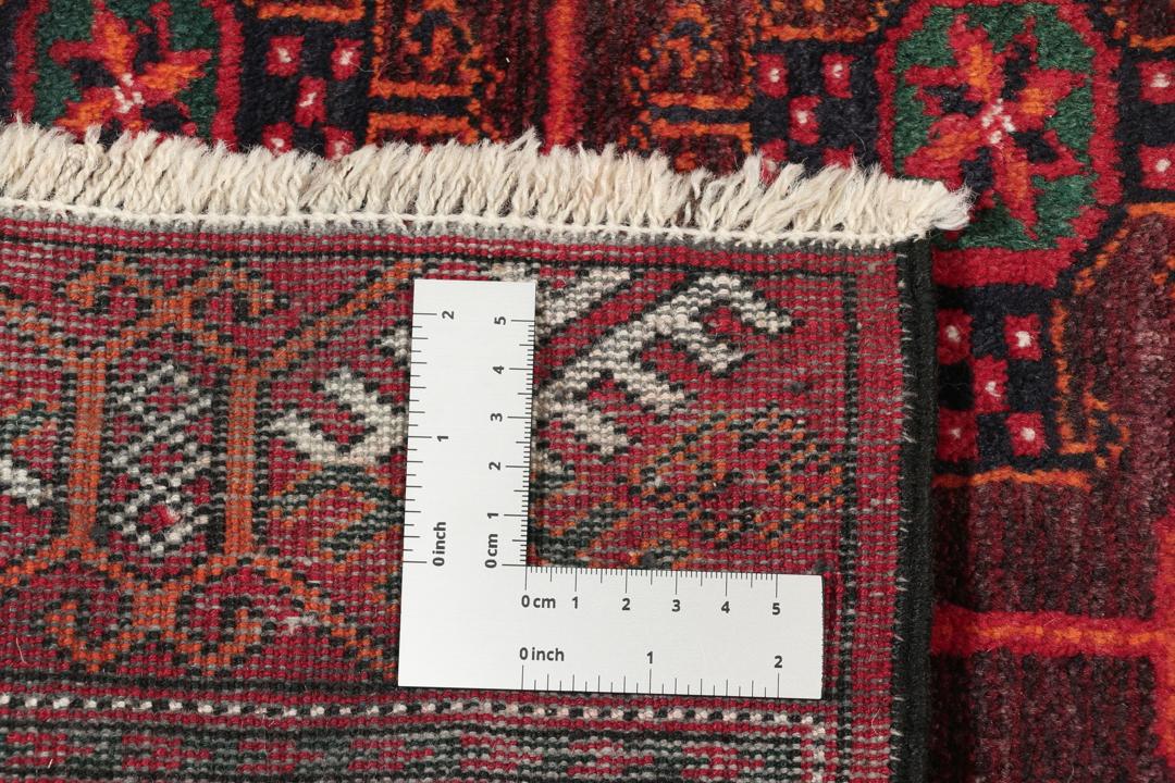 En håndknyttet Turkaman-løber i dyb rød med traditionelle geometriske mønstre.