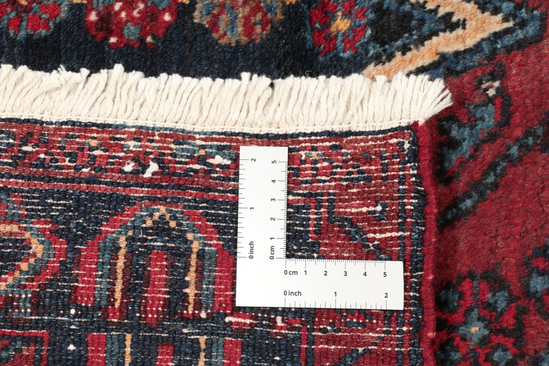 Handgeknoopte Senneh-loper in het rood met geometrische patronen uit het Midden-Oosten
