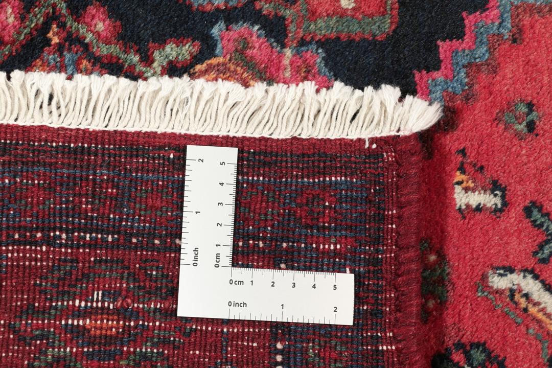 Håndknyttet Koliai-løber med et dristigt, geometrisk design i rød og sort