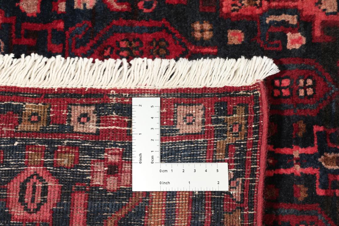 Handgeknoopt Koliai-tapijt uit het Midden-Oosten in donkerrode en zwarte tinten