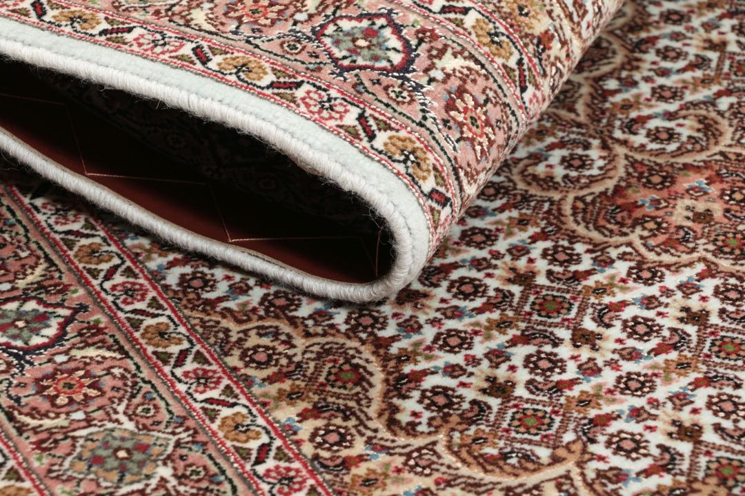 Håndknyttet Tabriz-tæppe fra Mellemøsten i dybe røde og beige nuancer