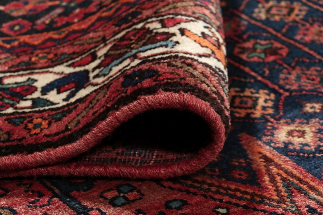 Handgeknoopt Kurdi Ghuchan tapijt in donkerrood en donkerblauw uit het Midden-Oosten