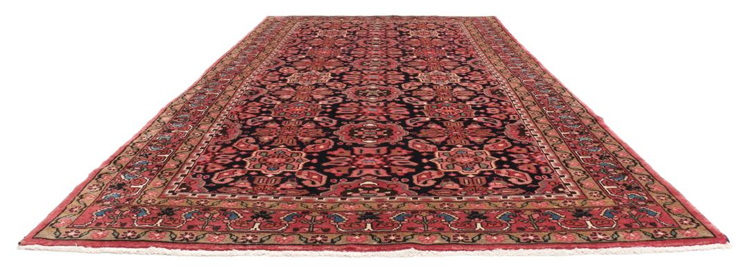 A rectangular hand-knotted Hamadan rug from the Middle East with a dark-red and black colour palette.