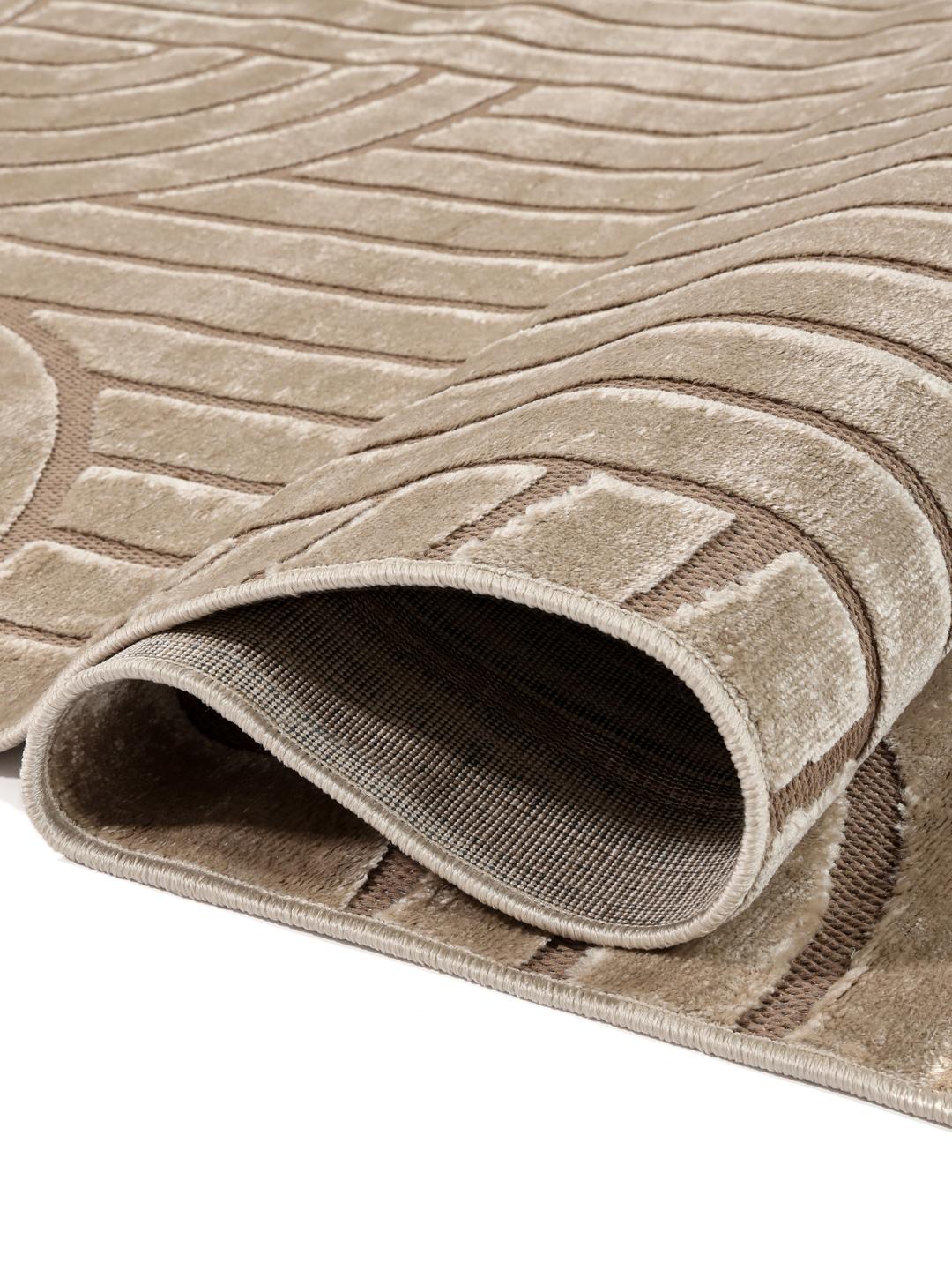 Onregelmatig beige vloerkleed met een modern hoog-laag geometrisch patroon