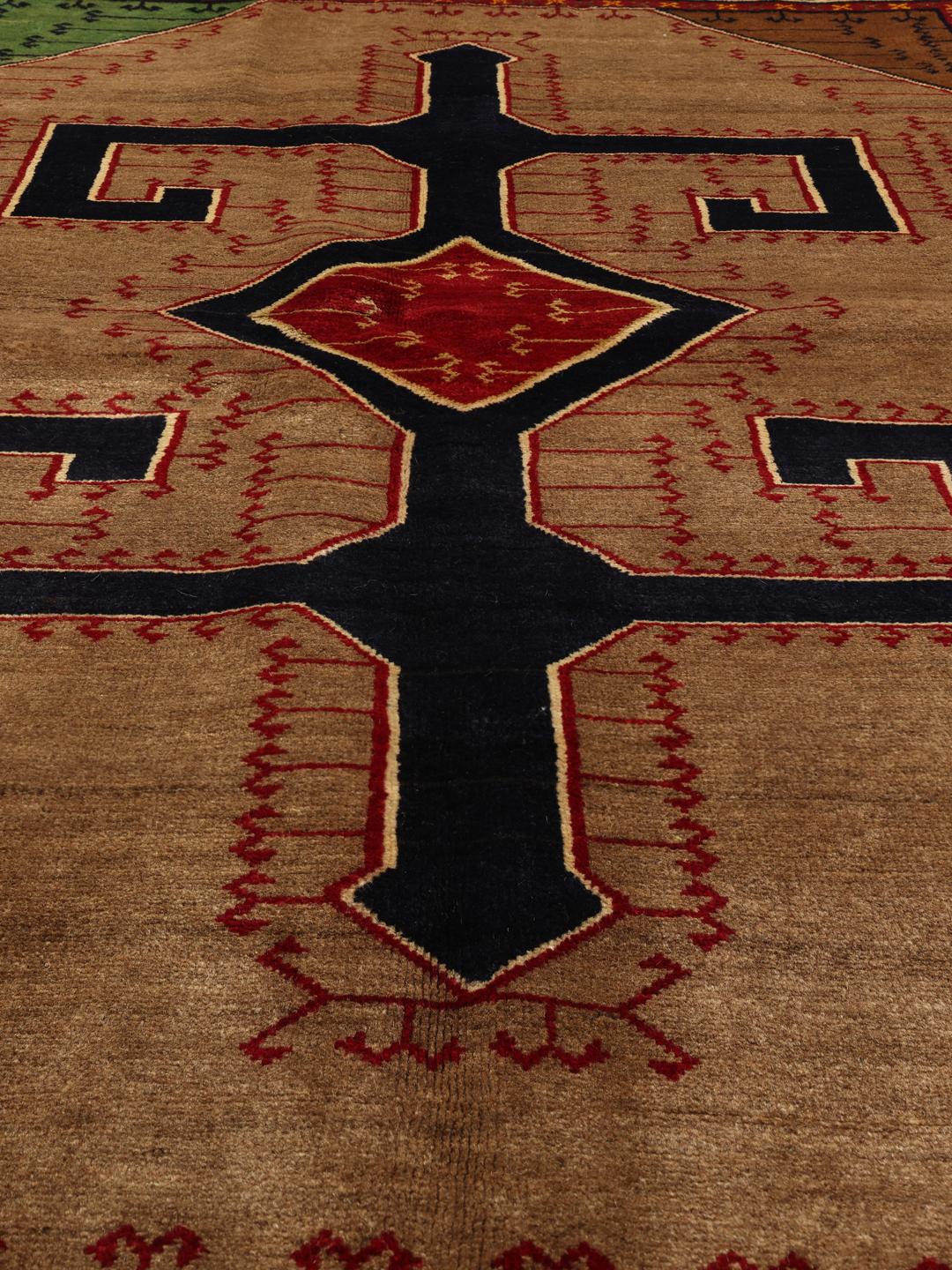 Hand-knotted Ghashghai rug from the Middle East with a brown field and geometric patterns